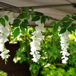 Solar Powered 180cm Artificial Leaf Garland With Wisteria Flowers - Warm White -B and M Store 379258 180cm solar powered artificial leaf garland with wisteria flowers 20 warm white micro leds
